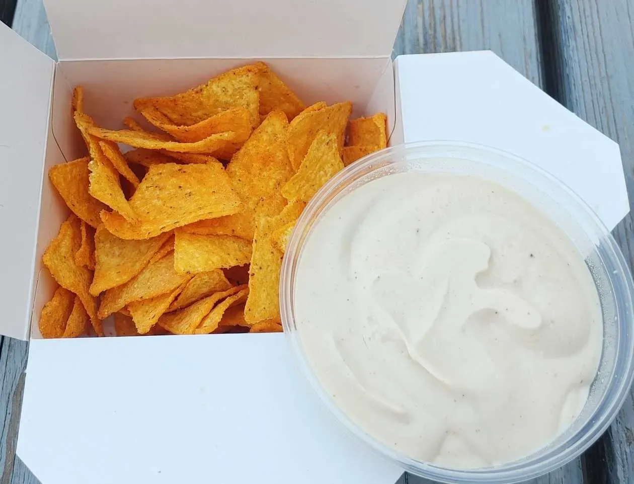Nachos in the box with cheese-chilli sauce