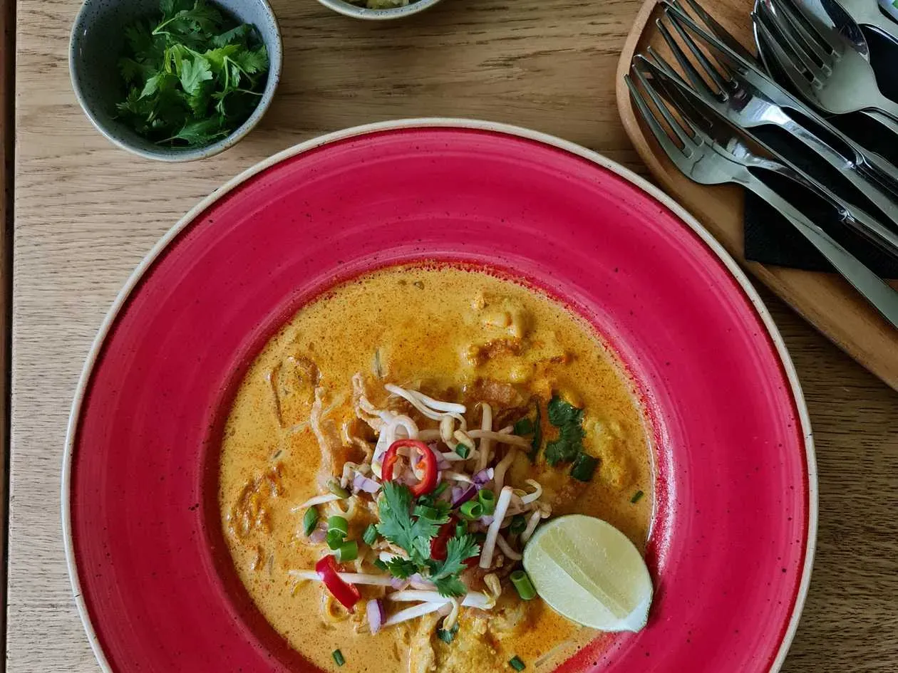 Khao Soi- Coconut milk and curry paste broth with anise, cinamon and peanut butter topped chicken