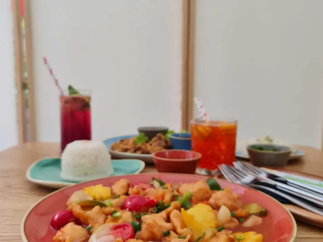 Stir fried chicken with vegetables and pineapple in sweet and sour sauce