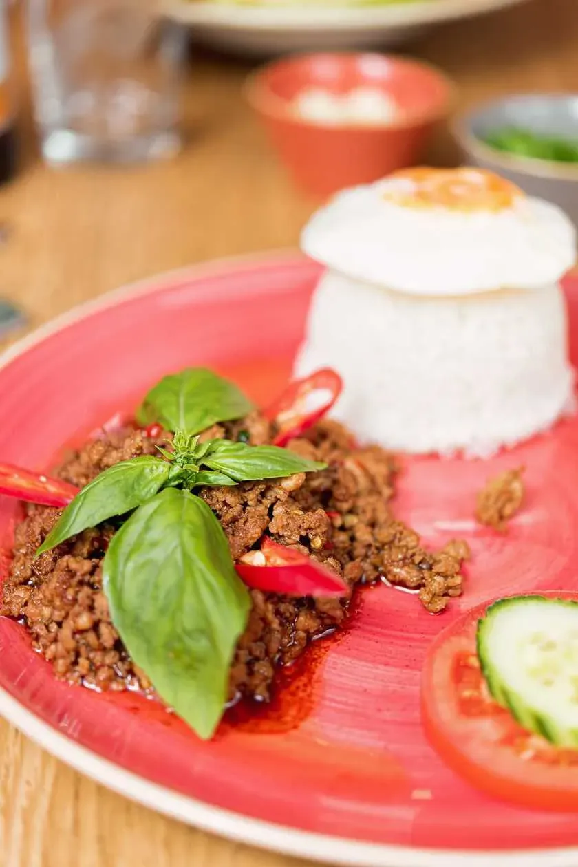Finely Chopped Pork with Chili and Thai Basil, Served with Jasmine Rice and Egg