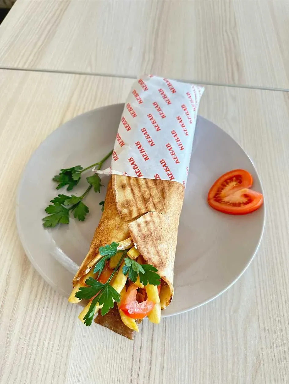 Kebab sandwich with fries and cheese