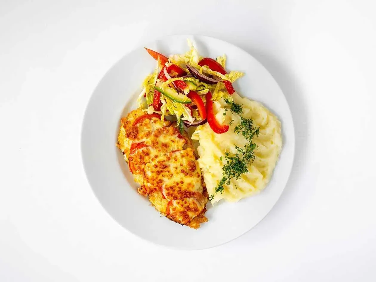 Chicken fillet in cheese and leek sauce served with jasmine rice