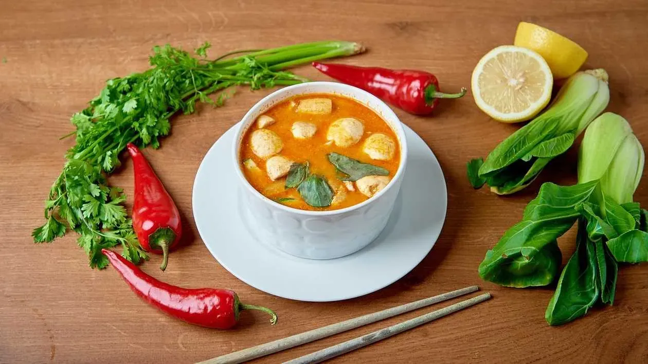 Tom Yum soup with rice spicy and aromatic Thai soup based on galangal and coconut milk