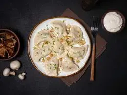 Pierogi z ziemniakami i borowikami - 10 szt (330 g)