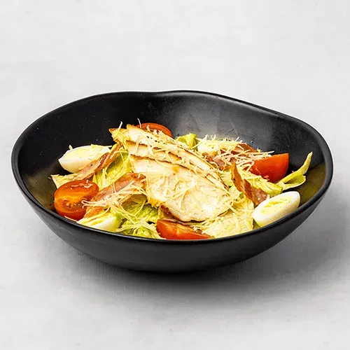 Caesar salad with chicken and bacon
