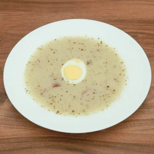 Sour rye soup with egg and sausage