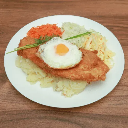 Chicken breast schnitzel with fried egg