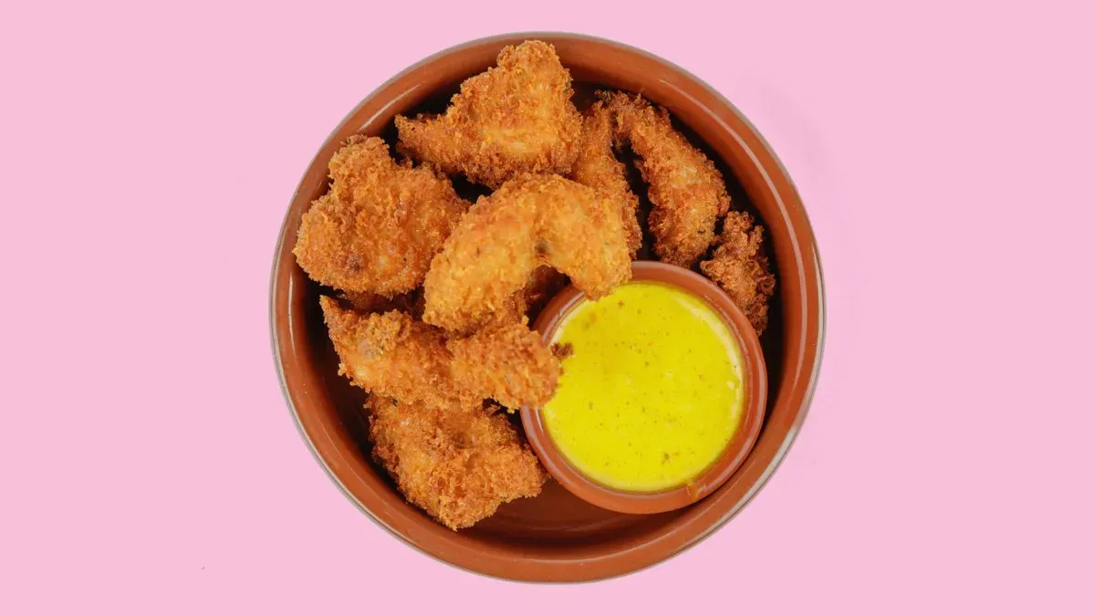 34. Pavo Empanado con Salsa Curry